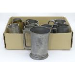 A quantity of pewter tankards, to include a Victorian quart mug with touch marks,