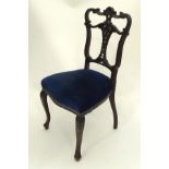 A Victorian chair with heavily moulded carved spalt CONDITION: Please Note - we do