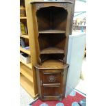 An oak corner cupboard with rose detail CONDITION: Please Note - we do not make