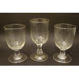Three assorted Georgian rummer pedestal drinking glasses,