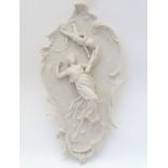 A 20thC Perfugium Regibus Rococo style carved marble plaque in high relief depicting a woman in