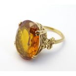A 9ct gold vintage retro cocktail ring set with large oval cut yellow sapphire approx 14.