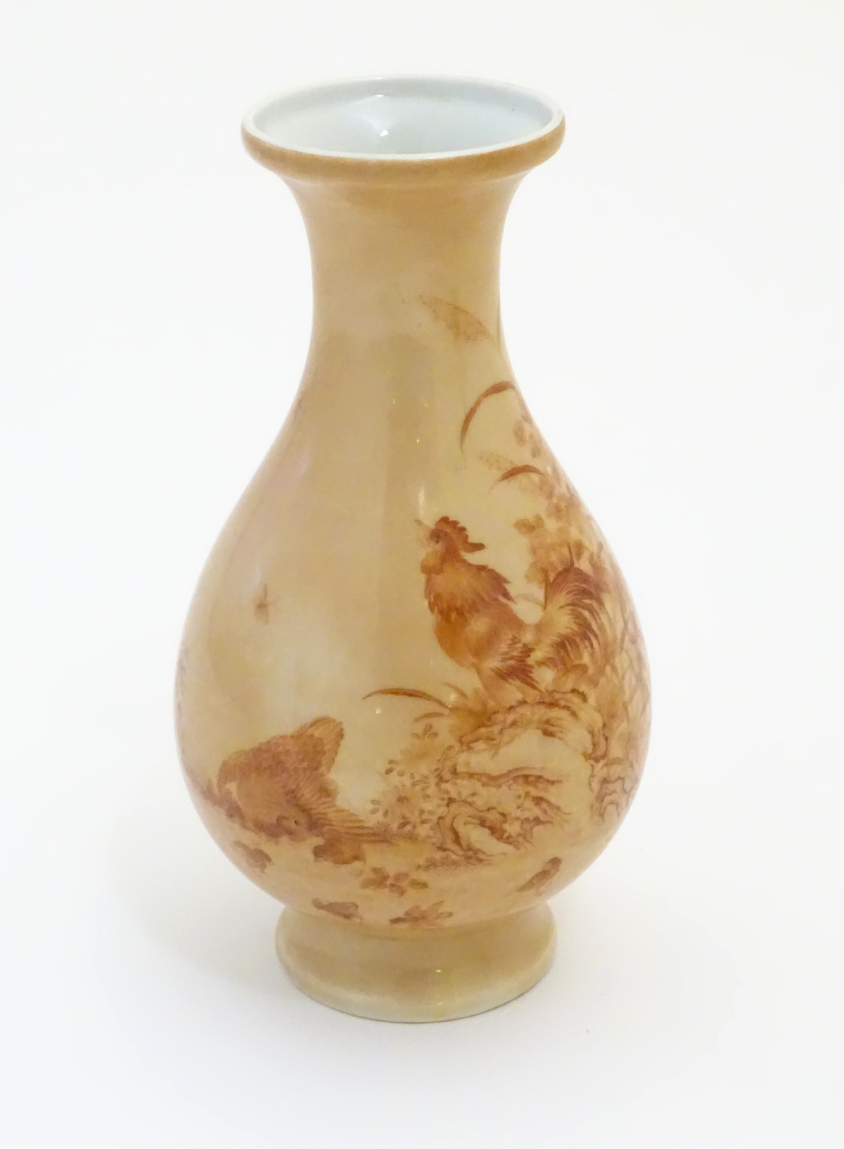 A Chinese baluster vase with a buff coloured ground decorated with a hen,