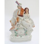 A 19thC Staffordshire flatback figural group of Bonnie Prince Charlie and Flora Macdonald seated