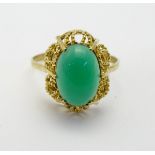 A 9ct gold ring set with green stone cabochon CONDITION: Please Note - we do not