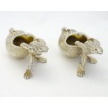 A pair of 21stC novelty silver plate salts formed as frogs.