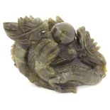 A Chinese dark spinach green coloured jade sculpture carved with 2 dragons and pearl of wisdom with