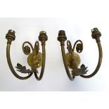 A pair of Edwardian brass wall lights,