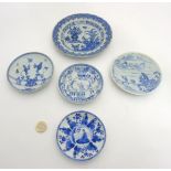 Five Chinese blue and white plates: A blue and white plate depicting butterflies and peonies on a