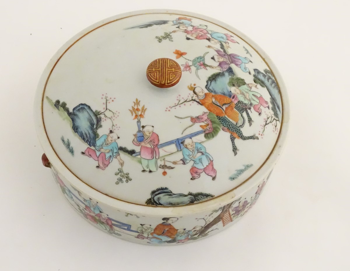 A Chinese lidded pot decorated with figures in a garden with flowers, fruit, vases etc. - Image 3 of 8