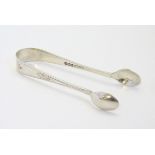 Silver sugar tongs with engraved decoration. Hallmarked Sheffield 1931 maker Hamilton Laidlaw & Co.