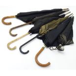 An assortment of late 19thC / early 20thC umbrellas,
