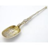 A silver teaspoon formed as an anointing spoon, hallmarked London 1910,
