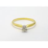 A yellow metal ring set with diamond solitaire CONDITION: Please Note - we do not