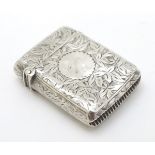 A Victorian small silver vesta case with engraved decoration.