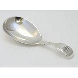 A Victorian silver fiddle pattern caddy spoon hallmarked London 1878 maker GA.