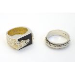 Two silver Gentleman's rings, one with dragon head decoration.