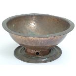 An Arts and Crafts copper bowl with hammered and pierced decoration. Approx.