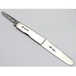 A silver fruit knife, having folding short knife to handle, hallmarked Sheffield 1905,