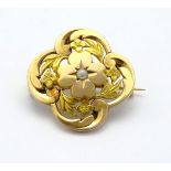 A 9ct gold brooch set with central seed pearl 1" diameter CONDITION: Please Note -