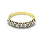 An 18ct gold ring set with 9 diamonds in a linear setting CONDITION: Please Note -