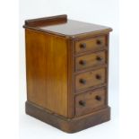 A late 19thC mahogany bank of four short graduated drawers with turned knob handles.