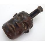 Ethnographic / Native / Tribal: A carved tribal helmet mask / headdress in the manner of Suku masks,