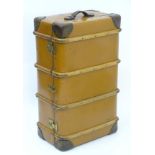A 20thC 'BCM Orient' steamer / travelling trunk, of hardened canvas construction with leather trim,