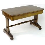 A 19thC mahogany library table with a rectangular top above two supports with roundel decorations