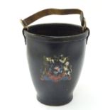 A leather fire bucket with traces of polychrome decoration of the Royal coat of arms.