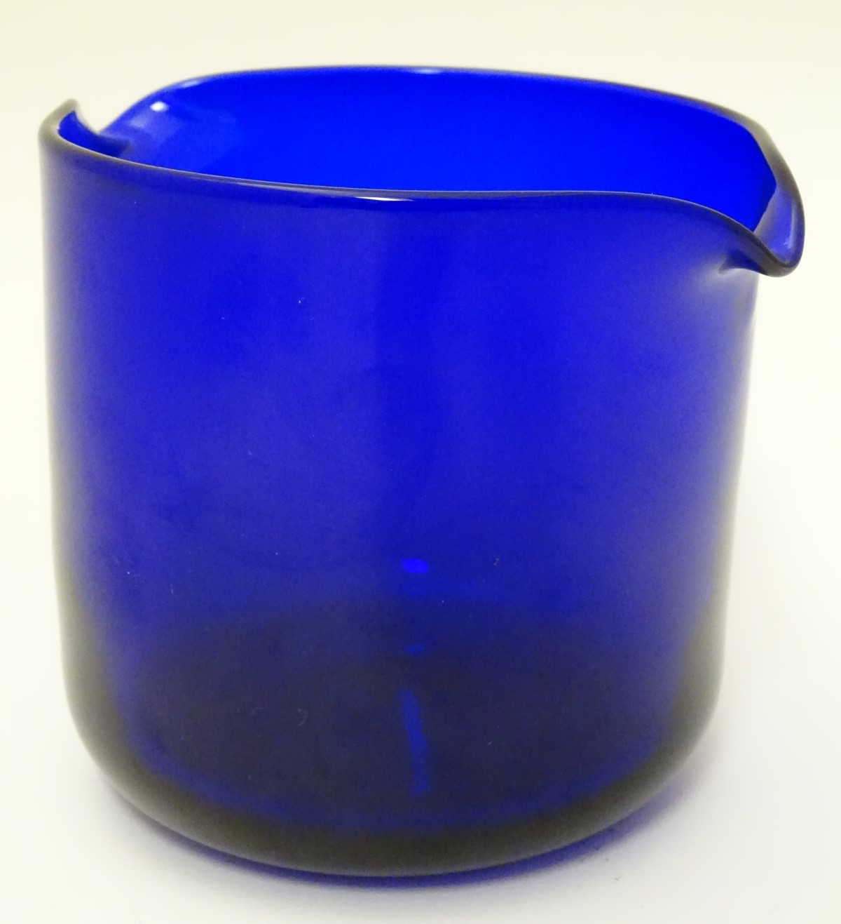 A 20thC Thomas Webb Bristol blue glass rinser, 4 1/2" tall, signed under.