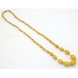 A vintage necklace of graduated butterscotch coloured beads.