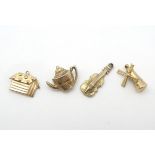 4 yellow novelty charms including a windmill, teapot,