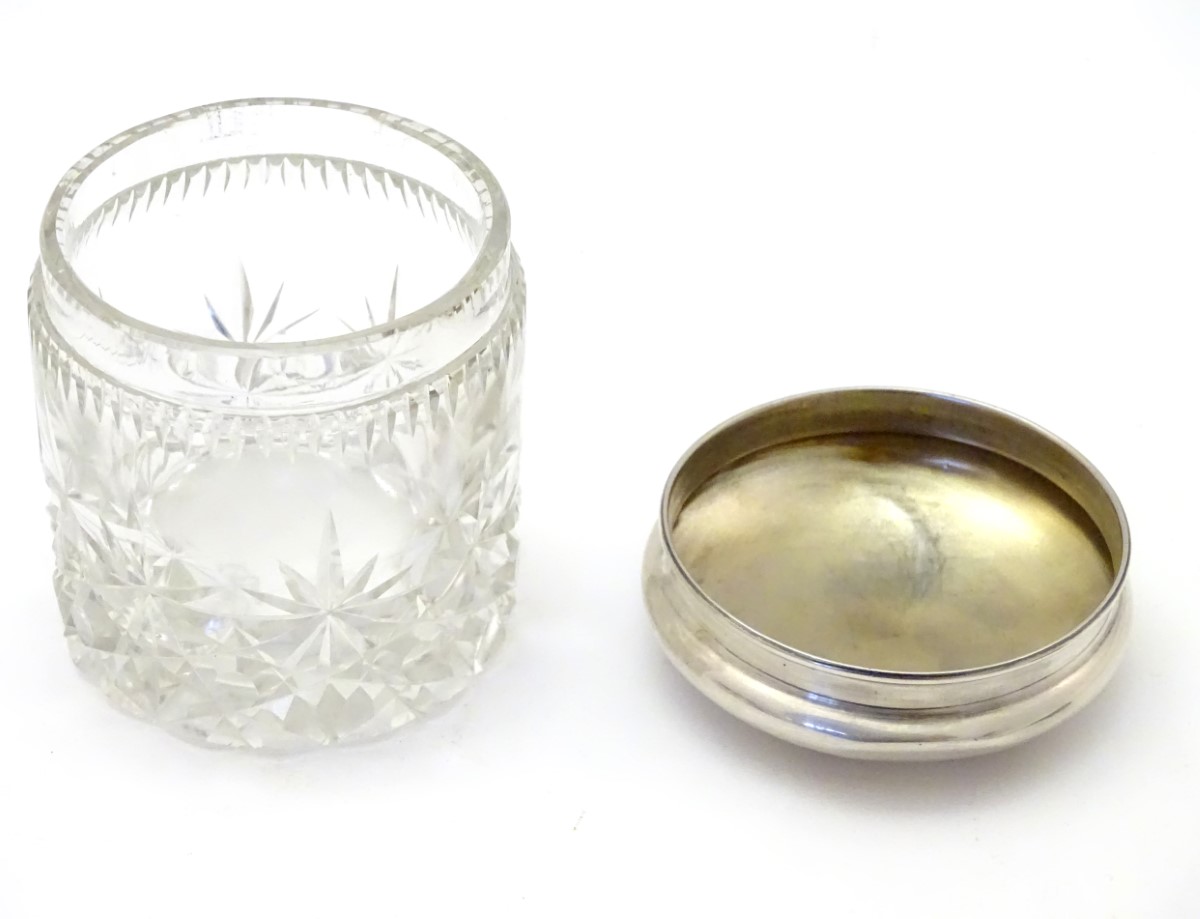 A cut glass dressing table jar with silver top hallmarked Birmingham 1924 maker Sanders & Mackenzie. - Image 5 of 6