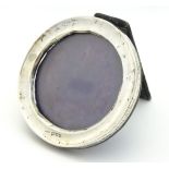 A silver photograph frame of circular form hallmarked Chester 1911 maker J & R Griffin.