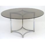 Richard Young - Merrow Associates: A mid century modernist designer dining table with chromed