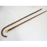 Walking Sticks: two sticks to include a gilt metal topped inlaid walking cane (34” long),