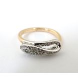 A 9ct gold ring set with diamonds in a loop setting CONDITION: Please Note - we do