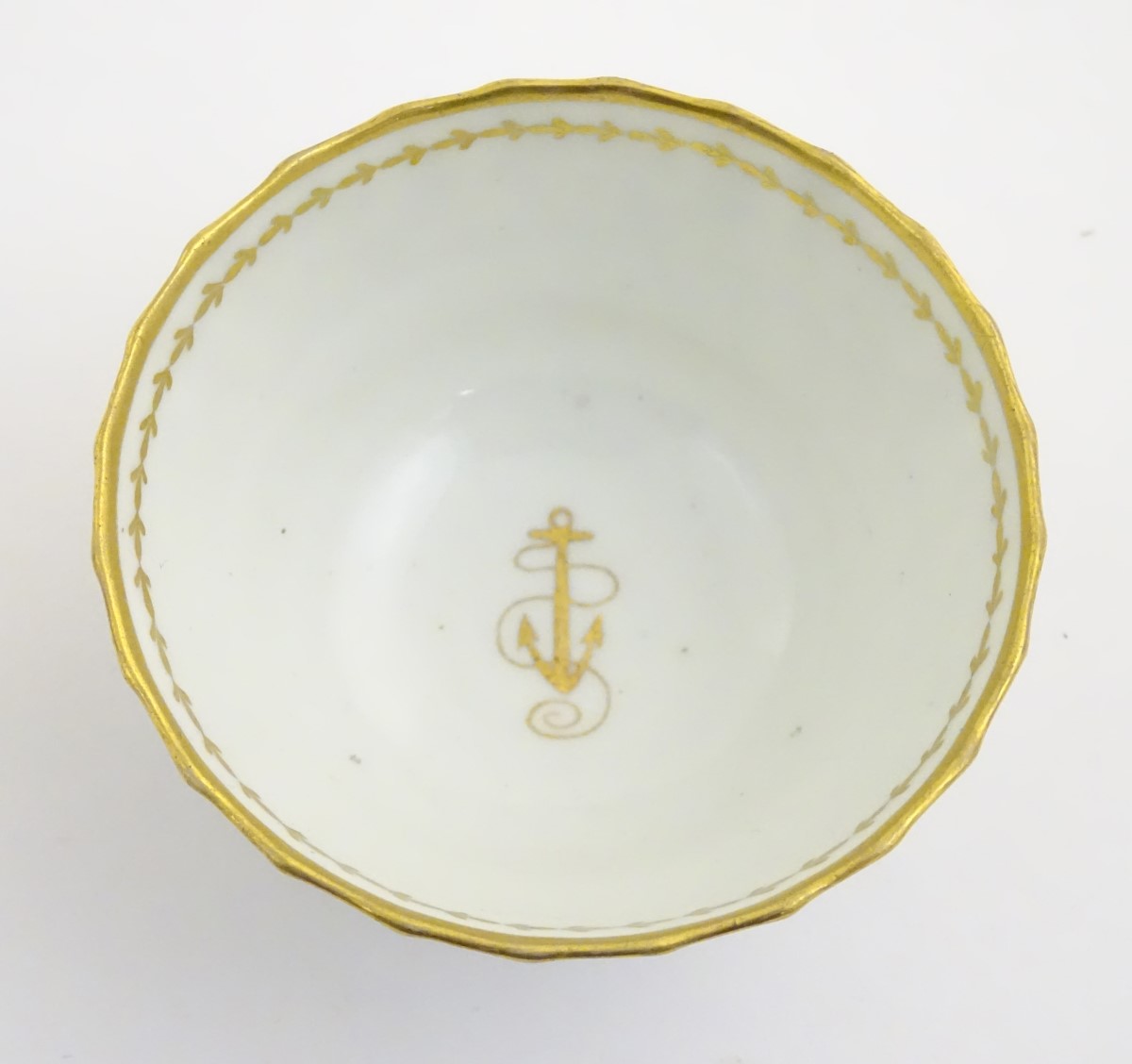 A 19thC white porcelain tea bowl with ribbed sides and gilt decoration of stylised foliage and - Image 4 of 7