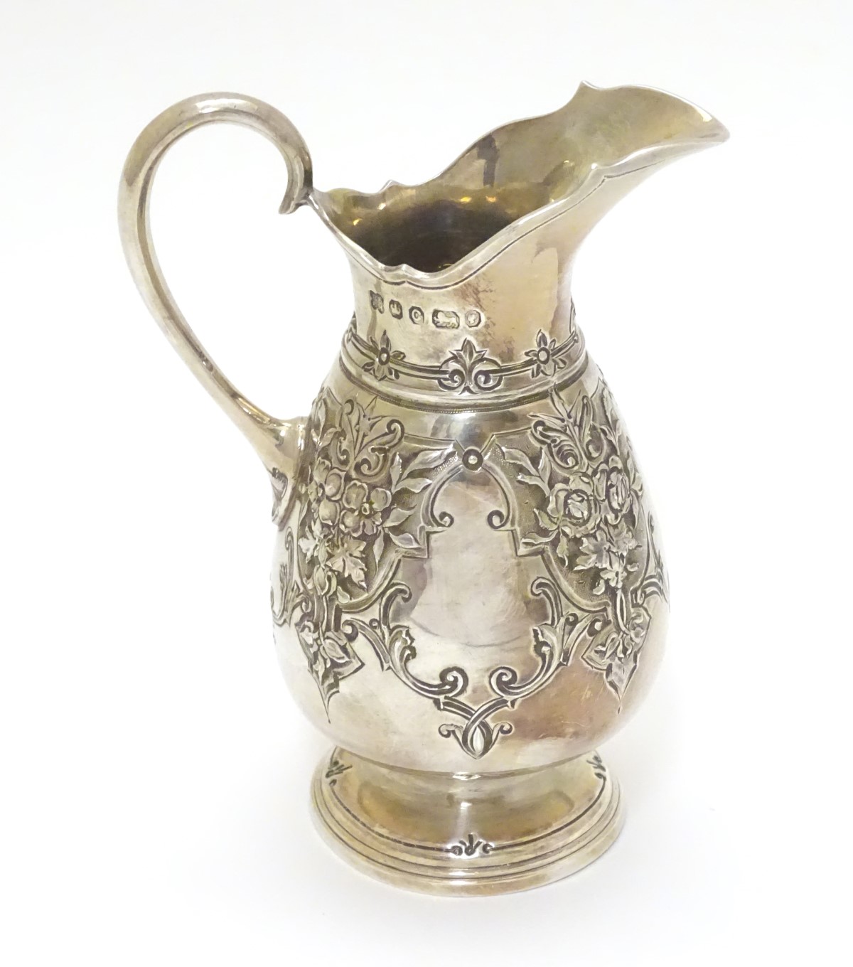 A Victorian silver cream jug hallmarked Sheffield 1870 maker Martin, Hall & Co.