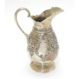 A Victorian silver cream jug hallmarked Sheffield 1870 maker Martin, Hall & Co.