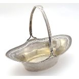 An American Sterling Silver cake basket with swing handle.