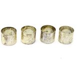 A set of four silver napkin rings hallmarked Birmingham 1917 maker George Randle.