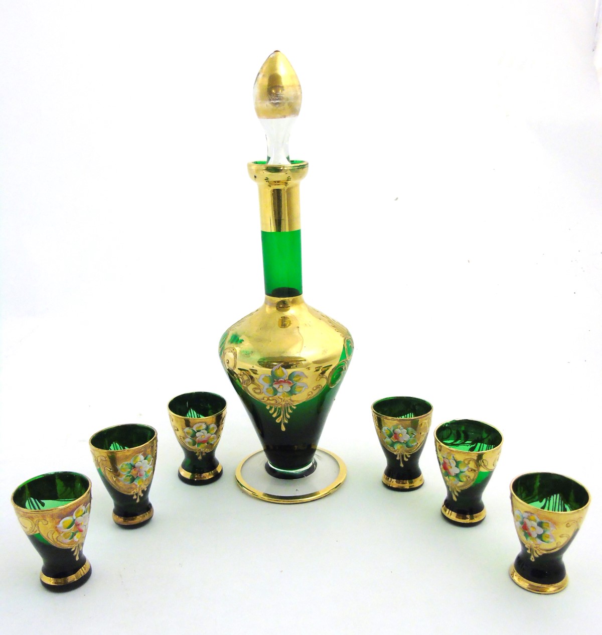 A mid 20thC Murano liqueur set, comprising green glass decanter and six glasses,