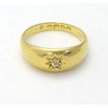 An 18ct gold ring set with central diamond. Hallmarked Chester 1918.(Approx 5.