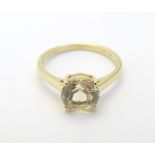 A 9ct gold ring set with white stone solitaire CONDITION: Please Note - we do not