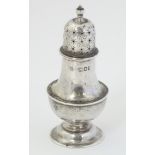 A silver pepperette hallmarked London 1904 maker William Hutton & Sons Ltd.