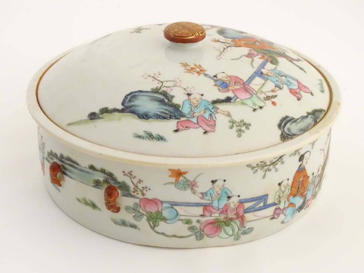 A Chinese lidded pot decorated with figures in a garden with flowers, fruit, vases etc. - Image 6 of 8