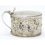 A silver mustard pot of ovoid form hallmarked Birmingham 1900 maker Cornelius Desormeaux Saunders &