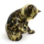 A Winstanley model of seated cat licking its paw. Marked under. Approx. 6 3/4" high.